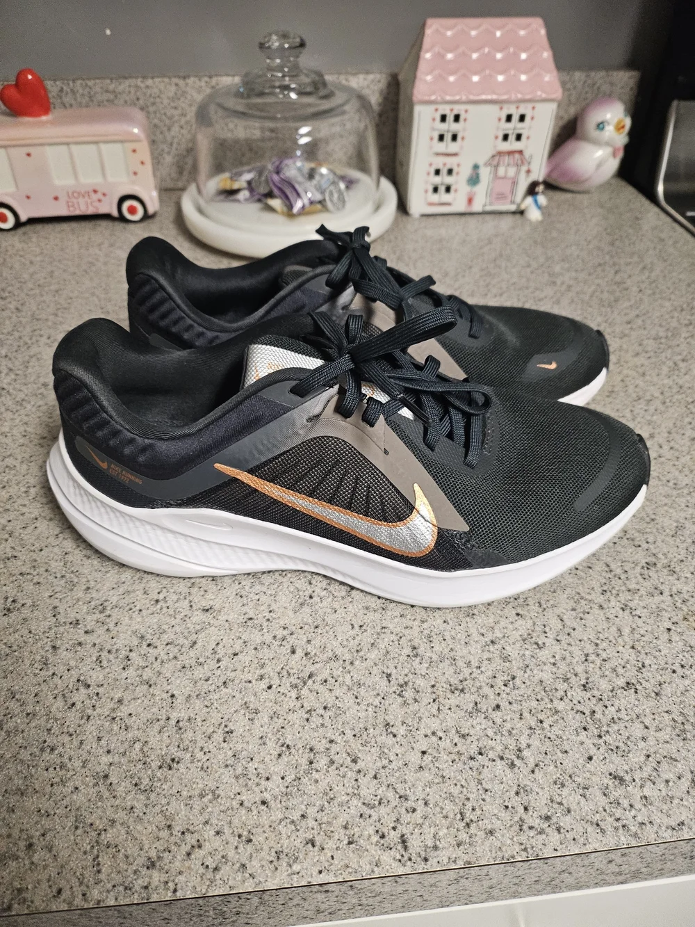 Nike Women's Black Running Shoes with Metallic Orange Swoosh